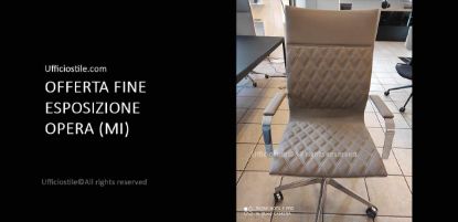 Poltrona direzionale imbottita con rivestimento trapuntato in tessuto CAT. D EXTREMA IKON colore 471, braccioli e basamento in alluminio cromato, ideale per uffici direzionali e ambienti professionali.