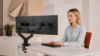 Rising™ braccio monitor doppio ergonomico con regolazione tramite molla a gas, attacco VESA, fissaggio Top Mount, finitura base nera e portata massima di 12,7 kg per monitor fino a 34”.