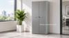 Armadio alto per ufficio con 2 ante battenti h 233 cm ambientato in ufficio moderno