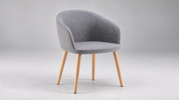 Poltroncina attesa con monoscocca a schienale basso in poliuretano schiumato a freddo ignifugo, base a 4 gambe in legno di frassino tinto noce e rivestimento in poliestere Trevira CS® Classe 1IM.