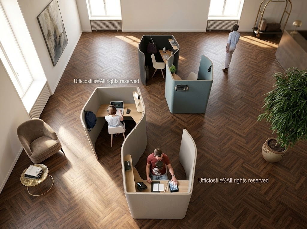 Phone booth e pannelli acustici inseriti in area coworking di un hotel